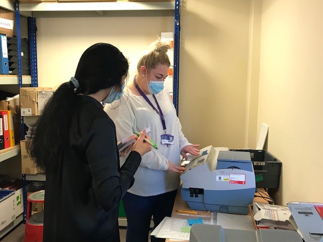 EI learning the franking machine at Dewis CIL
